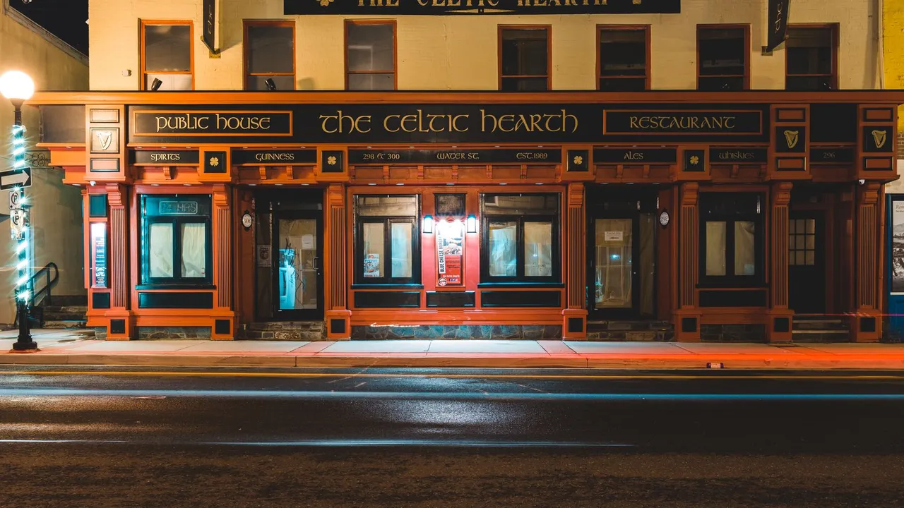Warmly lit restaurant frontage on Water Street in St. John's.